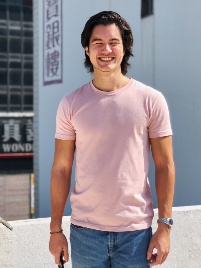 Christopher smiling on a rooftop.